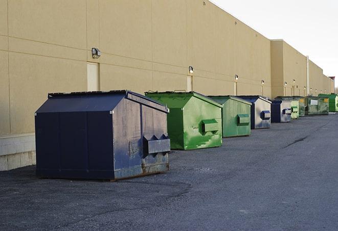 construction dumpsters filling up at a job site in Angelus Oaks